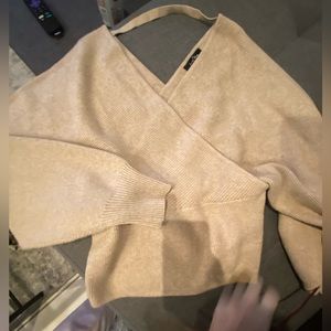 Woman’s warm fitted cream sweater size L. Puffy sleeves. Worn 1x